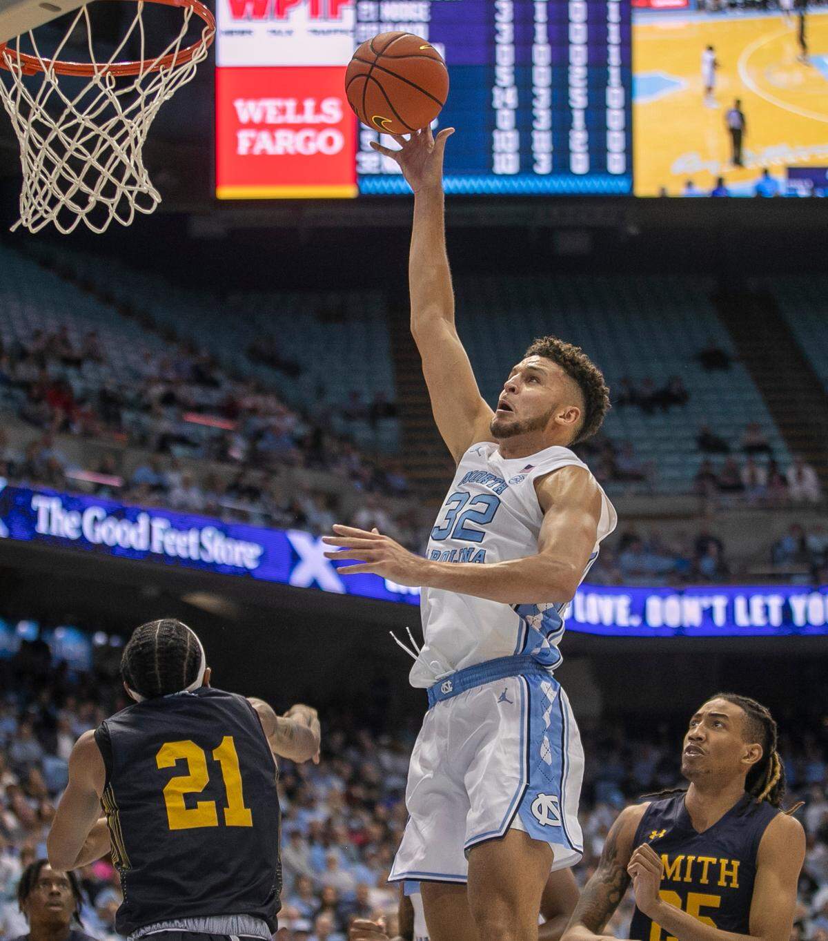 North Carolina’s Pete Nance (32) puts up a shot over Johnson C. Smith’s Nilous Hodge Jr. (21) in the first half during an exhibition game on Friday, October 28, 2022 at the Smith Center in Chapel Hill, N.C. Nance scored 19 points.