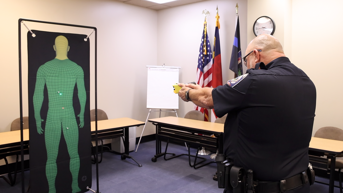 Pinehurst Police Deputy Chief Ken Hall demonstrates the use of a Taser in October 2024.