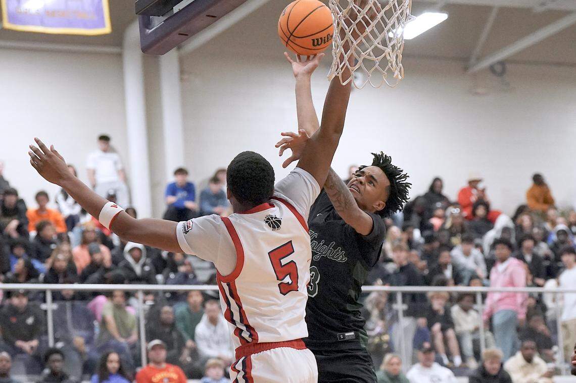 Greenfield's Kobe Edwards (3) shoots against Coronado's DeVaughn Dorrough (5) and fouled on the play during the second half. The Greenfield Knights and the Coronado Cougars (Nevada) met in the finals of the Day'Ron Sharpe bracket of the  John Wall Holiday Tournament in Raleigh, N.C. on December 30, 2025.