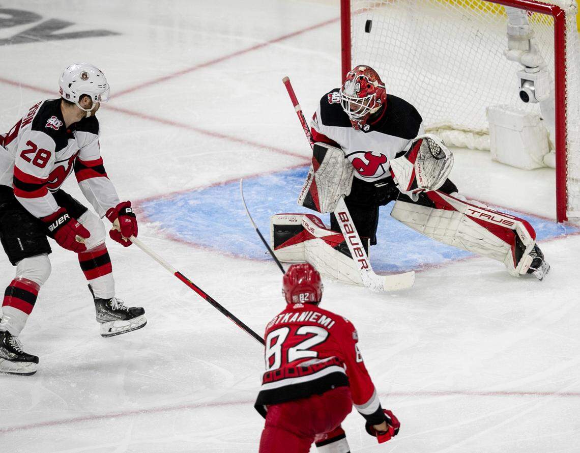 The Carolina Hurricanes Jesperi Kotkaniemi (82) scores the first of two goals against the New Jersey Devils goalie Akira Schmid (40) in the second period during Game 2 of their second round Stanley Cup playoff series on Friday, May 5, 2023 at PNC Arena in Raleigh, N.C.