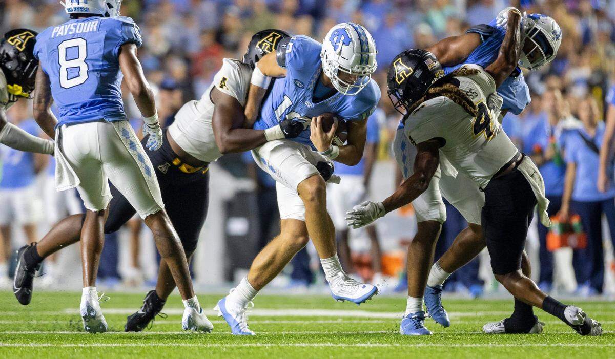North Carolina quarterback Drake Maye (10) rushes for six-yards and a first down in the final minute of play against Appalachian State on Saturday September 9, 2023 at Kenan Stadium in Chapel Hill, N.C. 