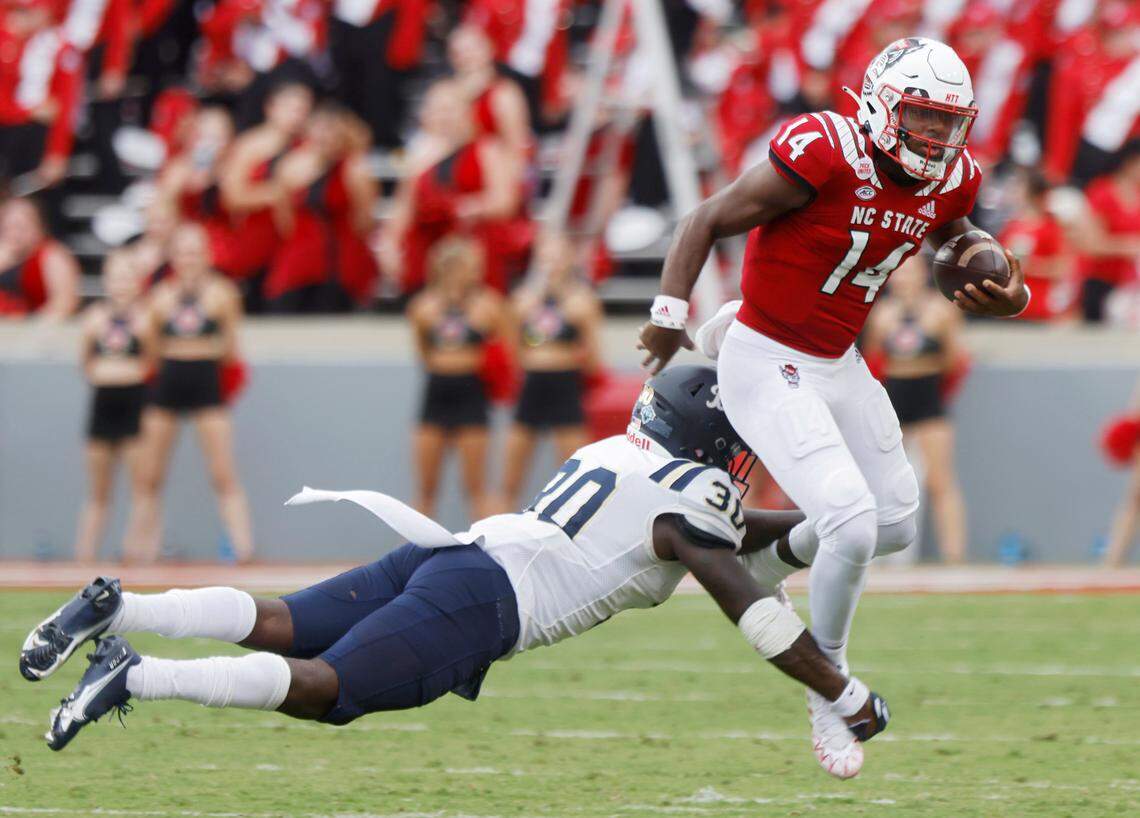 N.C. State quarterback Jack Chambers is brought down by Charleston Southern linebacker Shary Jefferson during the second half of the Wolfpackís game against Charleston Southern on Saturday, Sept. 10, 2022, at Carter-Finley Stadium in Raleigh, N.C.