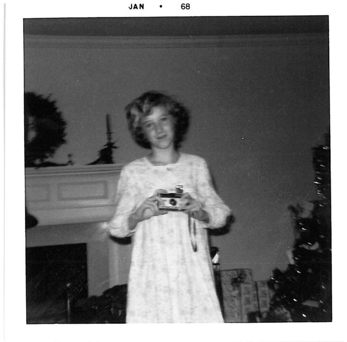 Susan Byrum Rountree, photographed in 1968, holds her first camera, a gift that came the day after the Apollo 8 crew broadcast from space.