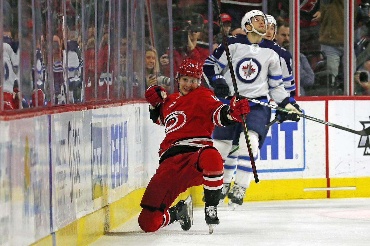 Carolina Hurricanes’ Martin Necas (88), of the Czech Republic, celebrates his goal against the Winnipeg Jets during the first period of an NHL hockey game in Raleigh, N.C., Tuesday, Jan. 21, 2020. (AP Photo/Karl B DeBlaker)