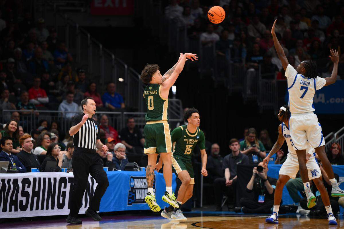 Mar 21, 2025; Seattle, WA, USA; Colorado State Rams guard Kyan Evans (0) shoots a three pointer over Memphis Tigers guard PJ Carter (7) during the second half at Climate Pledge Arena. Mandatory Credit: Steven Bisig-Imagn Images