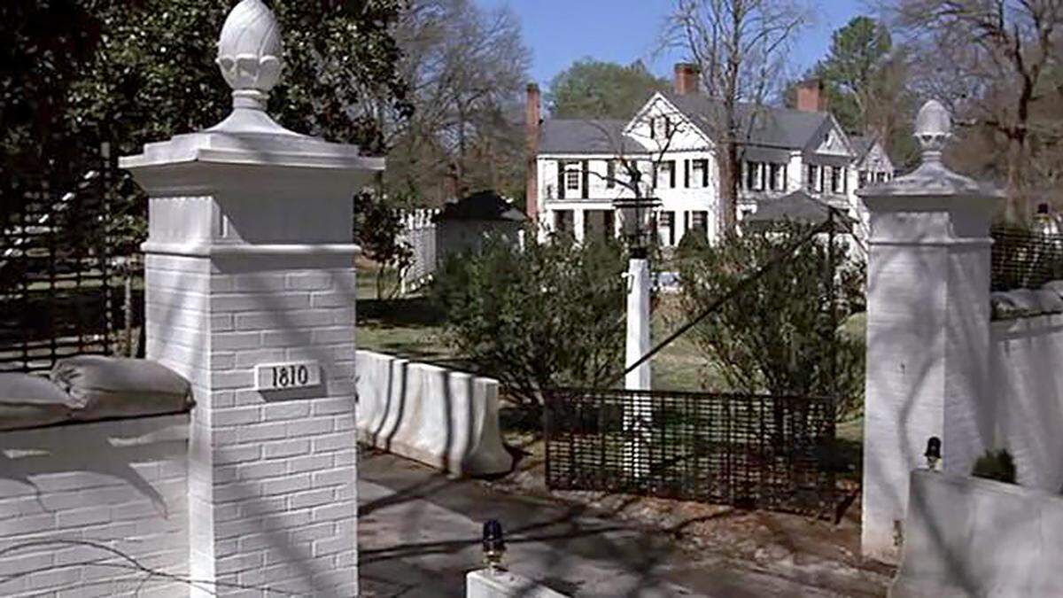 A photo of the entrance to the home at 1810 Cedar St. in Durham from the movie “The Handmaid’s Tale.” The photo shows sandbags and barricades used in the story.