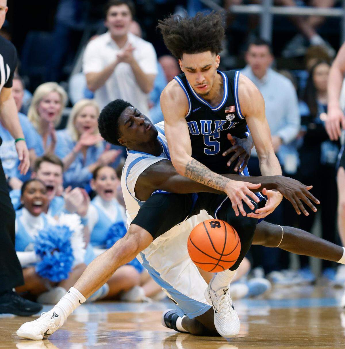 North Carolina’s Drake Powell (9) pressures Duke’s Tyrese Proctor (5) during the first half of Duke’s game against UNC at the Smith Center in Chapel Hill, N.C., Saturday, March 8, 2025.