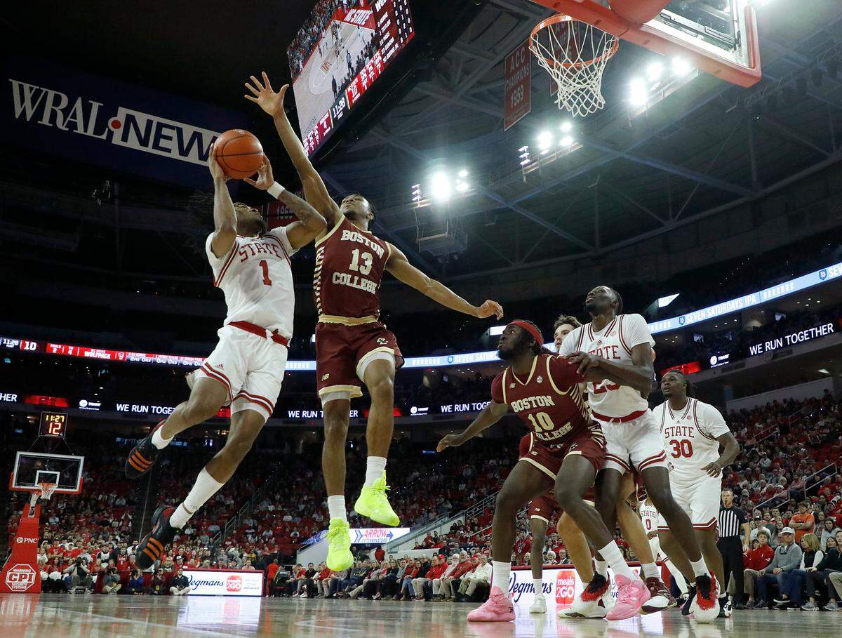 N.C. State’s Jayden Taylor drives to the basket against Boston College’s Donald Hand Jr. during the second half of the Wolfpack’s 81-70 win on Saturday, Feb. 24, 2024, at PNC Arena in Raleigh, N.C.
