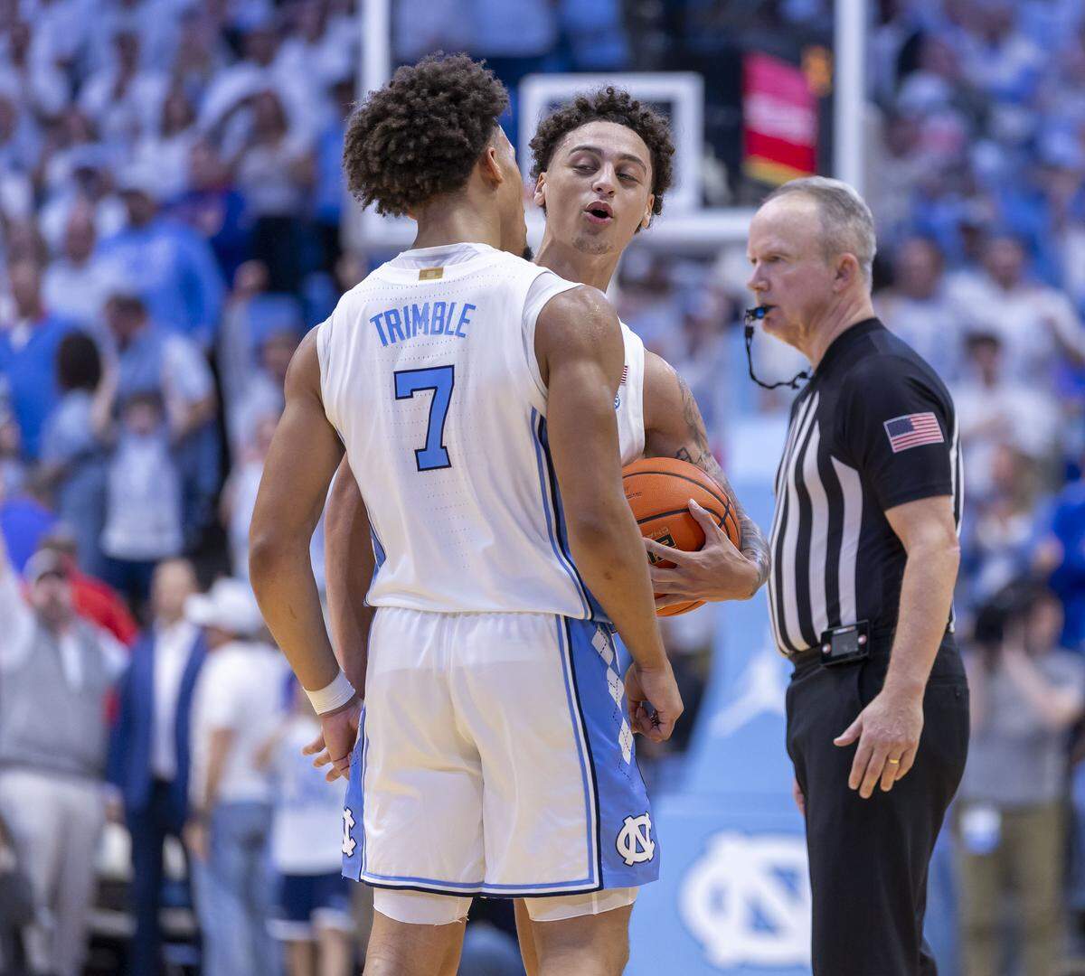 North Carolina guards Kyan Evans (0) and Seth Trimble (7) celebrate their 87-74 victory over Kansas on Friday, November 7, 2025 at the Smith Center in Chapel Hill, N.C.