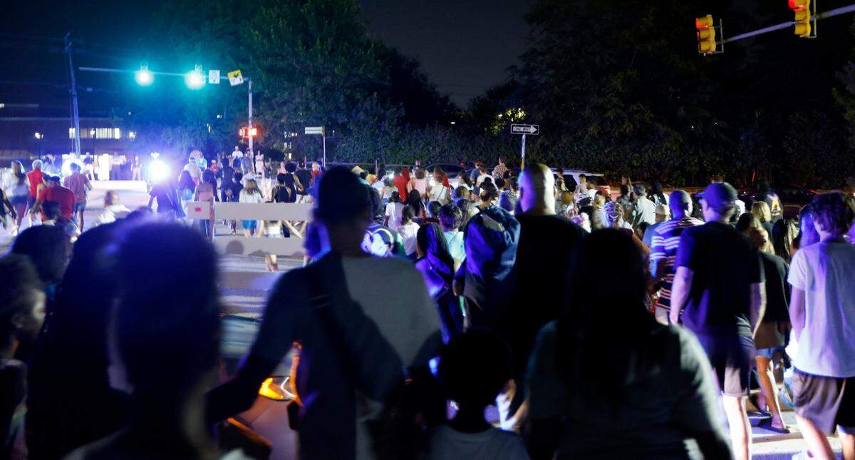 Crowds cross Western Blvd. at Hunt Drive after Raleigh’s 4th of July fireworks at Dorothea Dix Park in Raleigh, N.C., Monday, July 4, 2022.