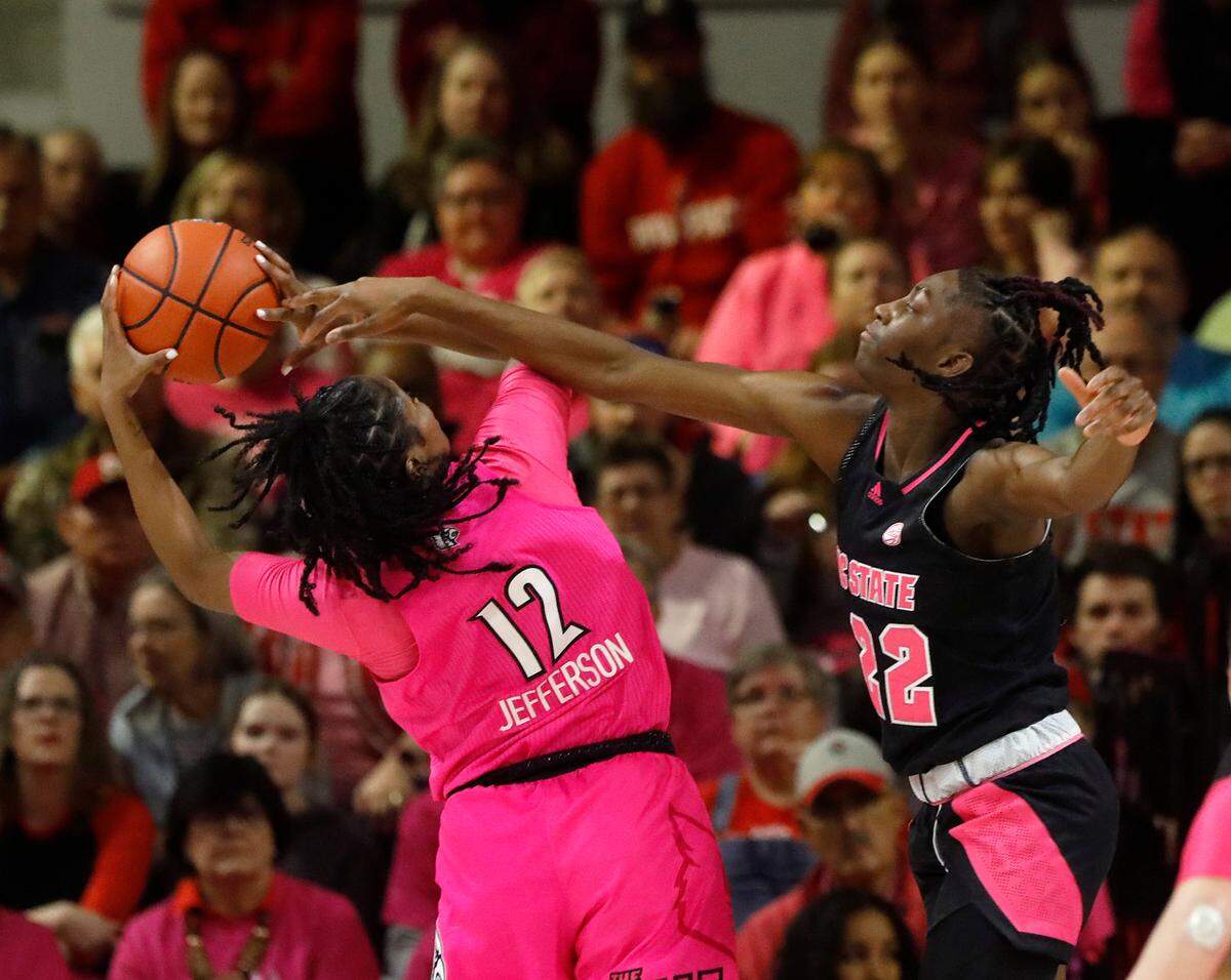 N.C. State’s Saniya Rivers fouls Louisville’s Kiki Jefferson during the first half of the Wolfpack’s 77-67 win on Monday, Feb. 5, 2024, at Reynolds Coliseum in Raleigh, N.C.