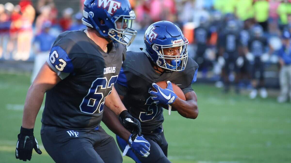 Wake Forest running back Maquel Haywood (3) runs behind lineman Ryan Moran (63) for his second touchdown run. The Richmond Raiders played football at the Wake Forest Cougars on Friday, August 24, 2018.