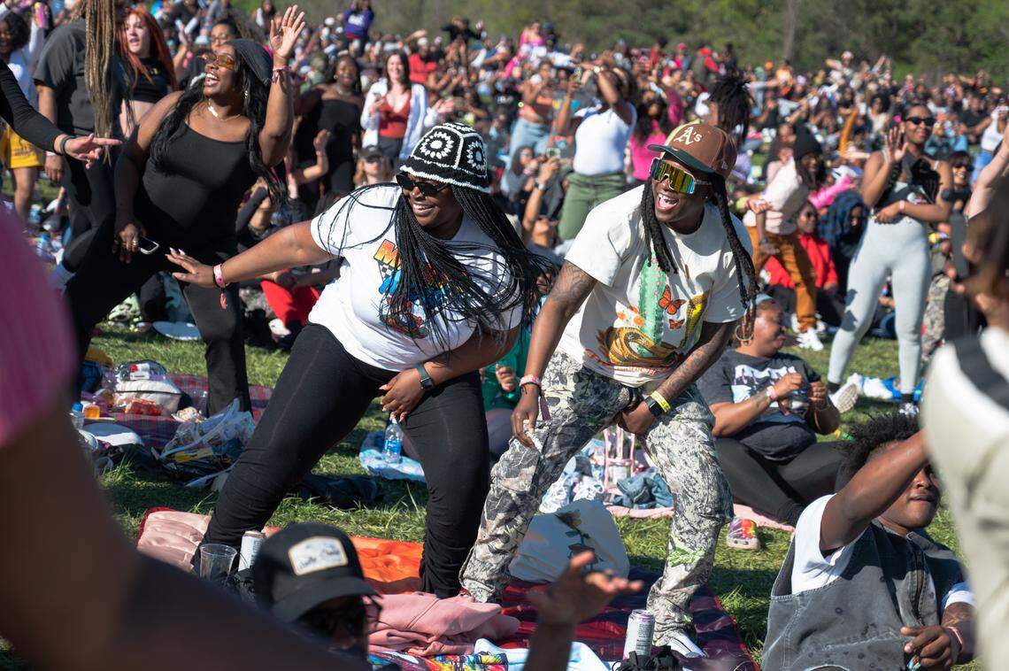 People dance while waiting for Monica to perform at the second day of Dreamville Festival in Raleigh, N.C. on Sunday, April 7, 2024.