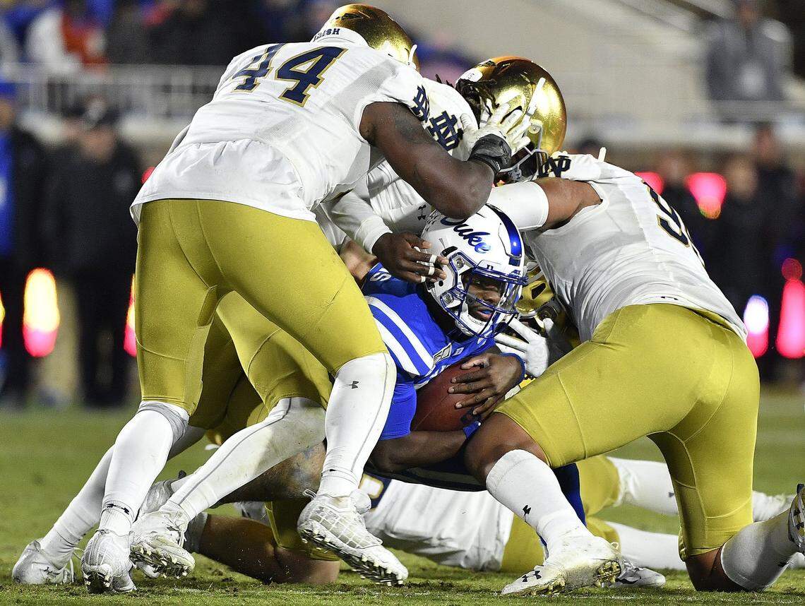 Quentin Harris of the Duke is stopped by a host of Notre Dame defenders during the third quarter at Wallace Wade Stadium in Durham, N.C., on Saturday, Nov. 9, 2019. Notre Dame won, 38-7. (Grant Halverson/Getty Images/TNS)