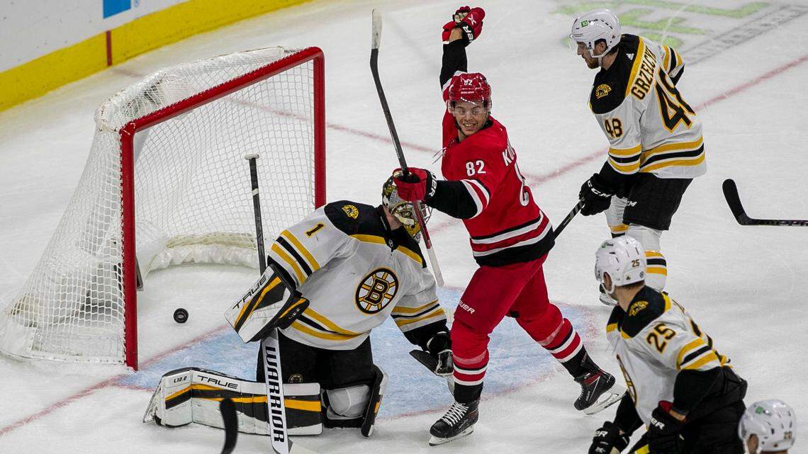 Carolina Hurricanes’ Jesperi Kotkaniemi (82) reacts after a goal by teammate Tony DeAngelo (77) during the first period against Boston on Thursday, October 28, 2021 at PNC Arena in Raleigh, N.C.