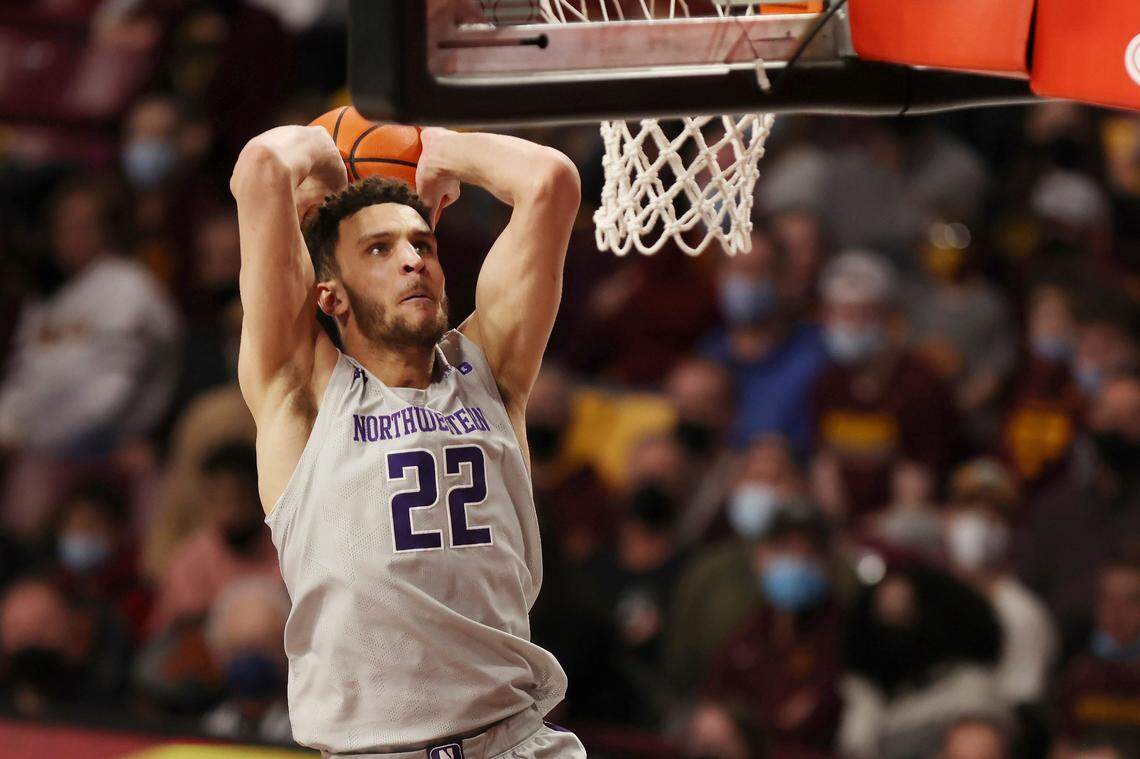 FILE - Northwestern forward Pete Nance (22) goes up to the basket against Minnesota during the second half of an NCAA college basketball game on Feb. 19, 2022, in Minneapolis. Nance says he’ll transfer to North Carolina. The 6-foot-10, 225-pound senior announced his commitment to play his fifth year for the Tar Heels in a social-media post Saturday, June 18 2022. (AP Photo/Stacy Bengs, File)