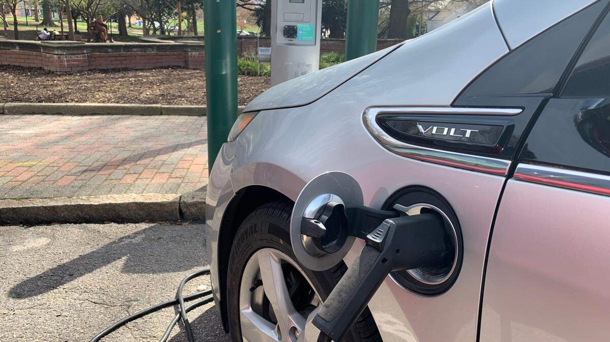 A Chevrolet Volt recharges at a free charging station at Nash Square, across from Raleigh’s municipal building downtown.