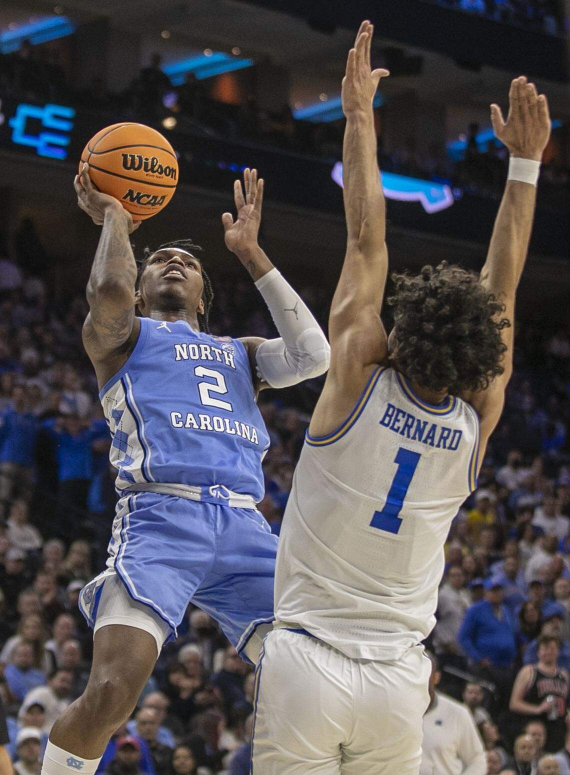North Carolina’s Caleb Love (2) drives to the basket against UCLA’s Jules Bernard (1)) during the second half on Friday, March 25, 2022 during the NCAA East Regional semi-final at Wells Fargo Center in Philadelphia, Pa.