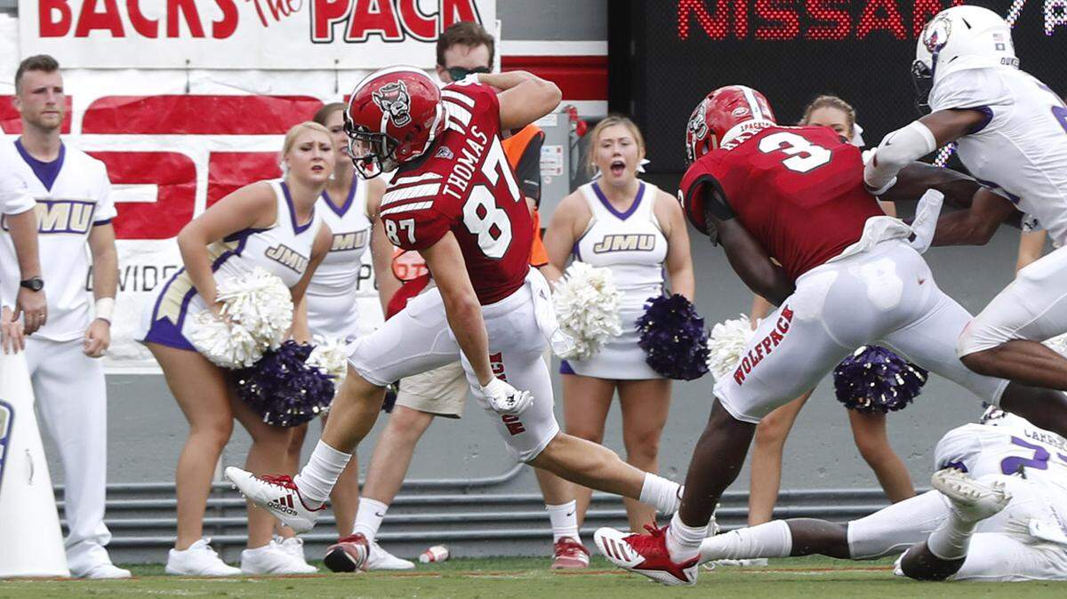 N.C. State’s Thayer Thomas (87) scores on a 16-yard touchdown reception during the first half of N.C. State’s game against James Madison at Carter-Finley Stadium in Raleigh, N.C., Saturday, Sept. 1, 2018.