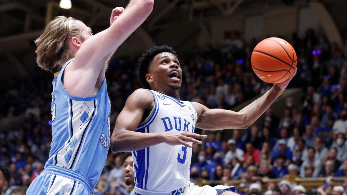 Dukeís Jeremy Roach (3) heads to the basket as North Carolina’s Brady Manek (45) defends during the first half of Dukeís game against UNC at Cameron Indoor Stadium in Durham, N.C., Saturday, March 5, 2022.