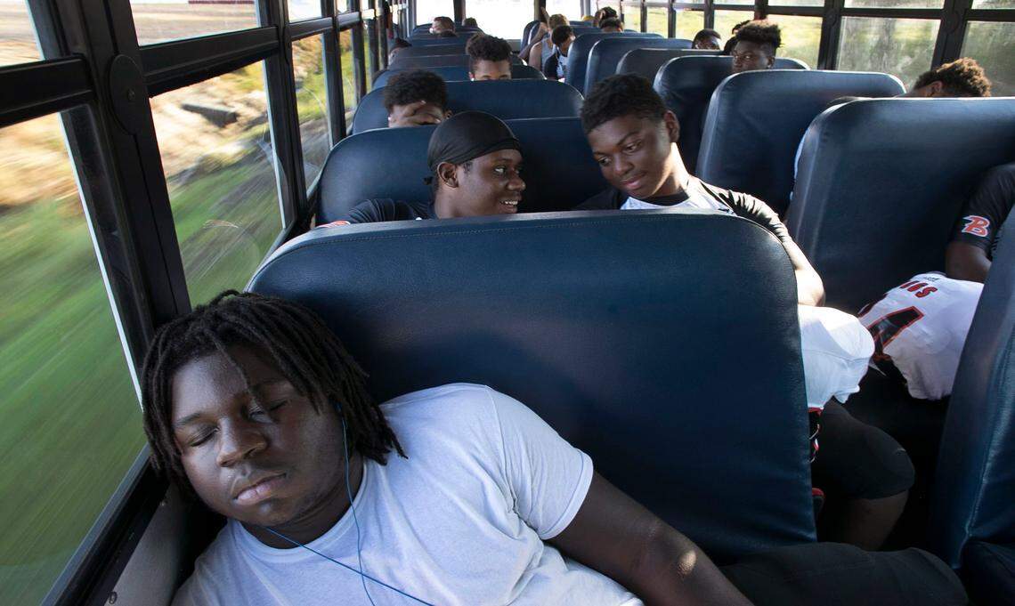 Wallace-Rose Hill’s Javario Bryant (58) catches a nap on the team bus during the trip from Teachey to Seven Springs for the Bulldog’s first game since Hurricane Florence on Friday, October 5, 2018.