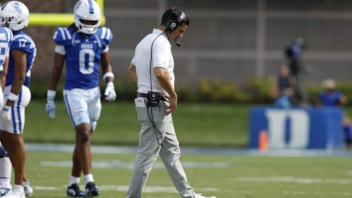 Duke head coach Manny Diaz walks on the field during a timeout in the second half of the Blue Devils’ 45-19 loss to Illinois on Saturday, Sept. 6, 2025, at Wallace Wade Stadium in Durham, N.C.