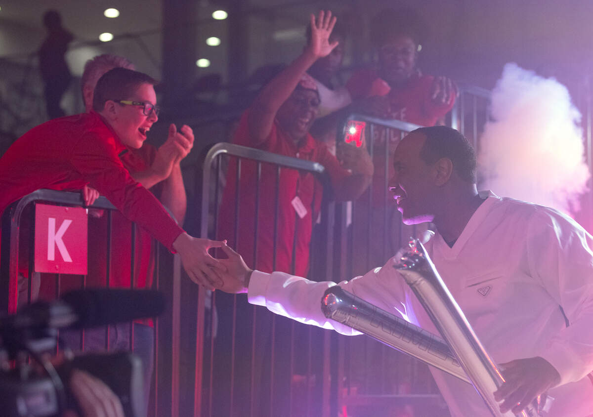 N.C. State men’s basketball head coach Kevin Keatts greets a fan after being introduced at the “Primetime with the Pack” preseason event on Thursday, Oct. 26, 2023, at Reynolds Coliseum in Raleigh, N.C.