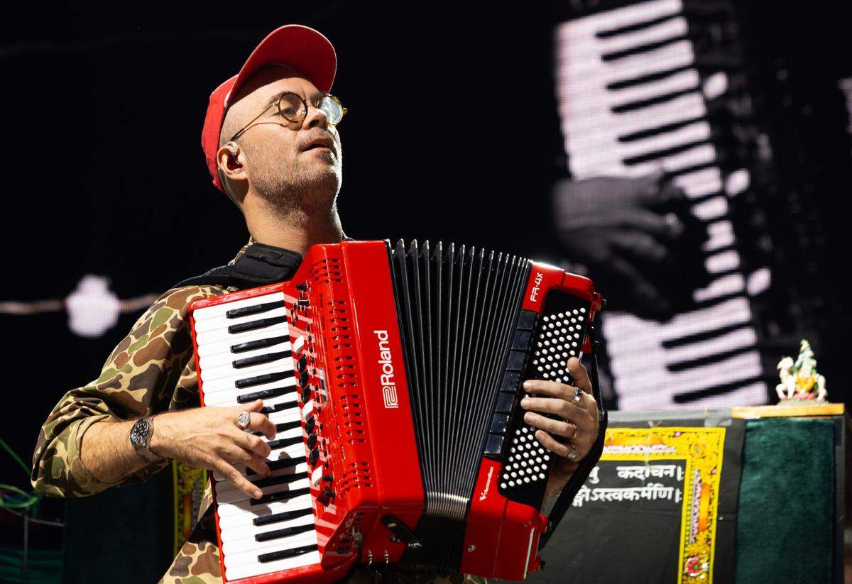 Kory Caudill holds forth on the accordian as Tyler Childers plays Raleigh, N.C.’s Coastal Credit Union Music Park at Walnut Creek, Wednesday night, April 23, 2025.