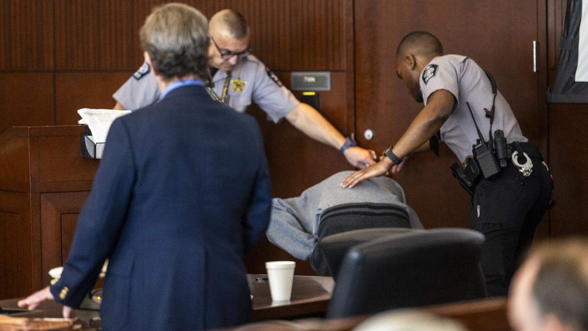 Tyrell Moore is led from the courtroom by Wake County sheriff's deputies during his sentencing hearing after he began gagging and vomiting and was taken for medical evaluation on Monday, June 1, 2026, at the Wake County Justice Center in Raleigh. Moore pleaded guilty earlier this year to voluntary manslaughter in the death of David Millette Jr., who died after Moore struck him during a confrontation in Raleigh's Glenwood South district in August 2023. 