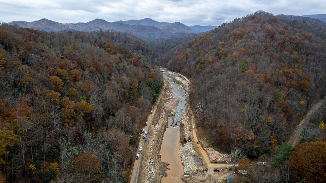NCDOT contractors work to repair and replace a 14-mile stretch of U.S. 19W along the Cane River in Yancey County after the remnants of Hurricane Helene caused an estimated $1 billion in damage to the two-lane highway.