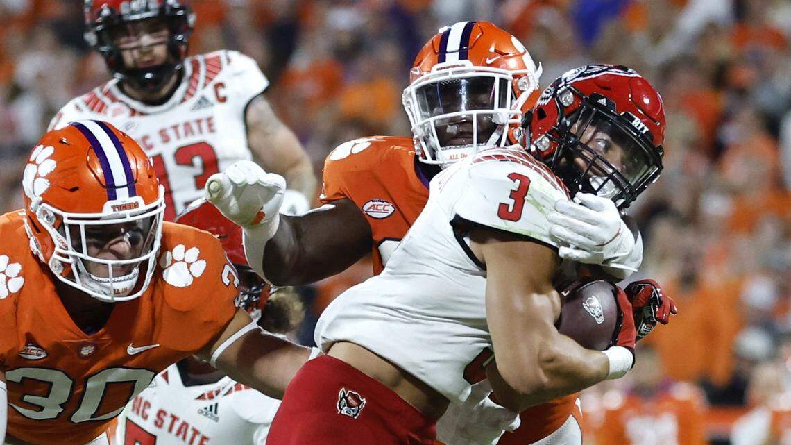 N.C. State running back Jordan Houston (3) can’t get by Clemson defensive tackle Etinosa Reuben (32) during the first half of N.C. State’s game against Clemson at Memorial Stadium in Clemson, S.C., Saturday, Oct. 1, 2022.