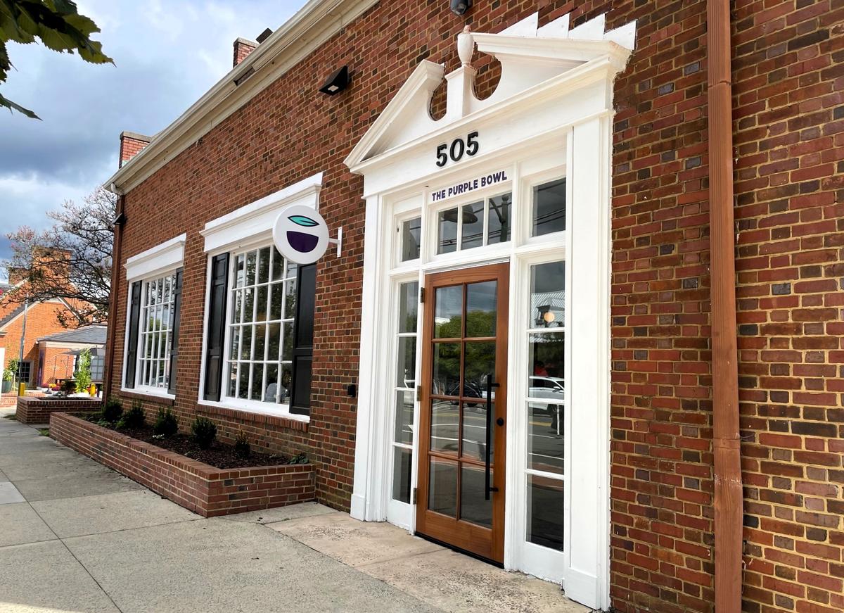 An understated sign marks the front door of Purple Bowl’s newly renovated restaurant at 505 W. Franklin St. in Chapel Hill, NC. The renovation preserved much of the former Chapel Hill News office, with a few modern additions.