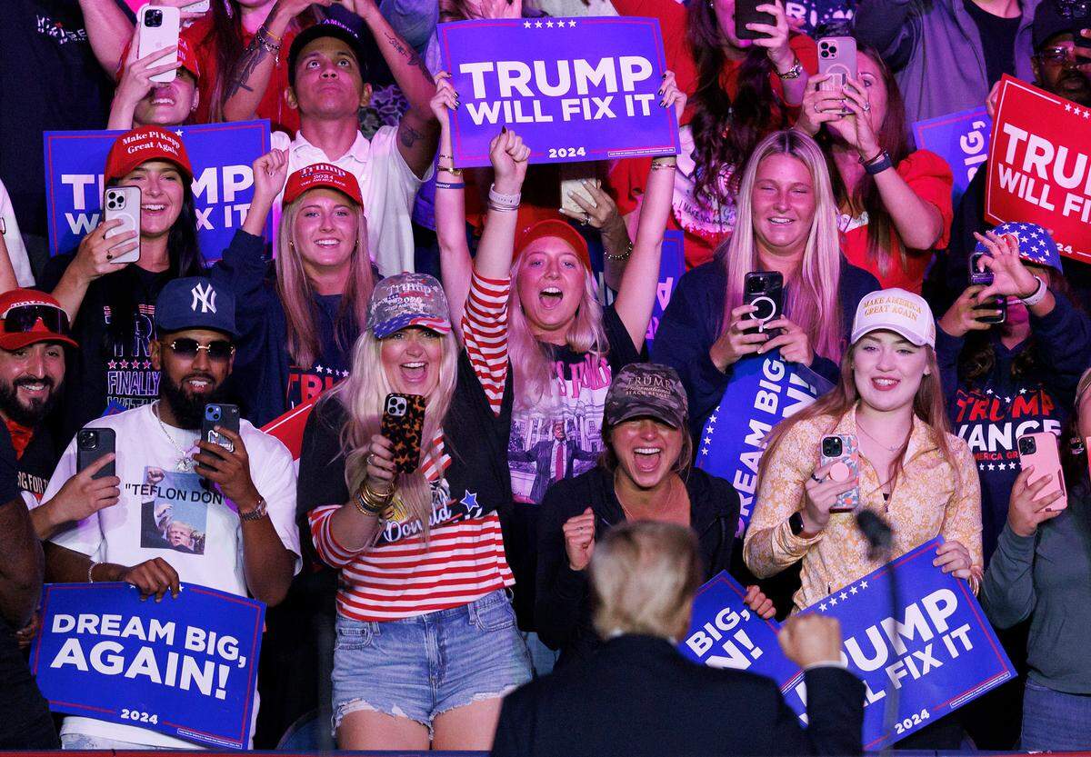 Former President and Republican presidential candidate Donald Trump greets supporters following his remarks at a campaign rally at First Horizon Coliseum in Greensboro, N.C. on Saturday, Nov. 2, 2024.