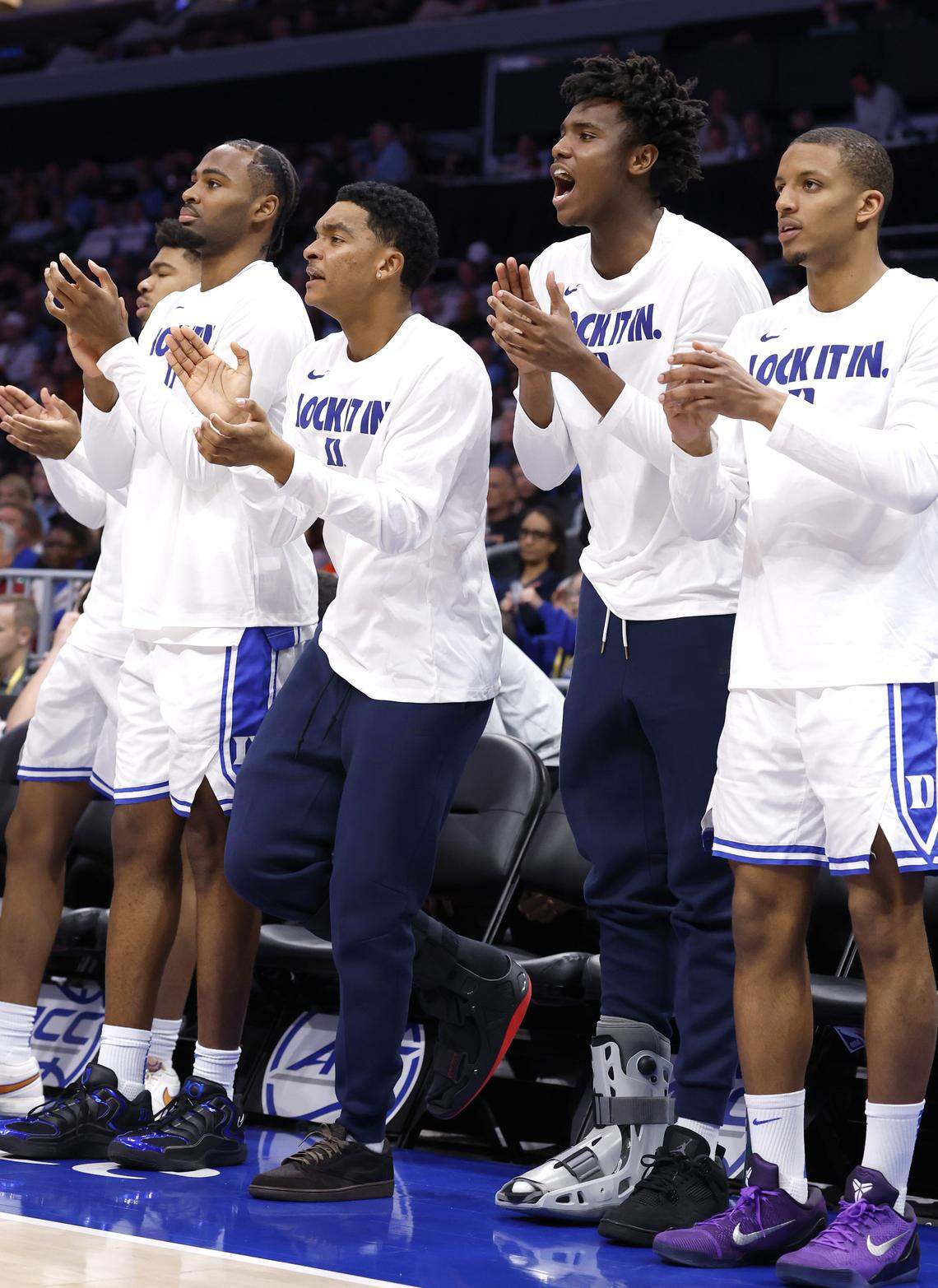 Duke’s Caleb Foster and Patrick Ngongba II cheer on the Blue Devils in the second half of Duke’s 80-79 victory over Florida State in the quarterfinals of the 2026 ACC Men’s Basketball Tournament at the Spectrum Center in Charlotte, N.C., Thursday, March 12, 2026.
