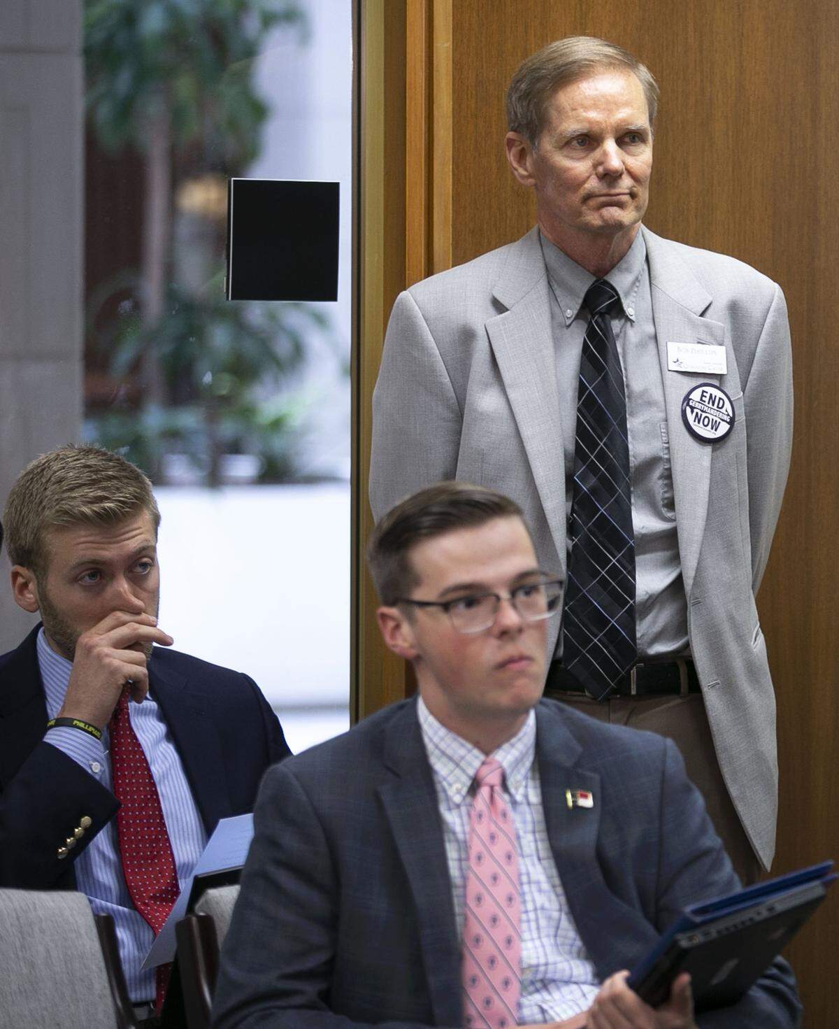 Bob Phillips, executive director of Common Cause of North Carolina, listens to Rep. David Lewis of Dunn, N.C. as Lewis addresses the Supreme Court ruling on gerrymandering during a press conference on June 27 at the General Assembly in Raleigh, N.C.