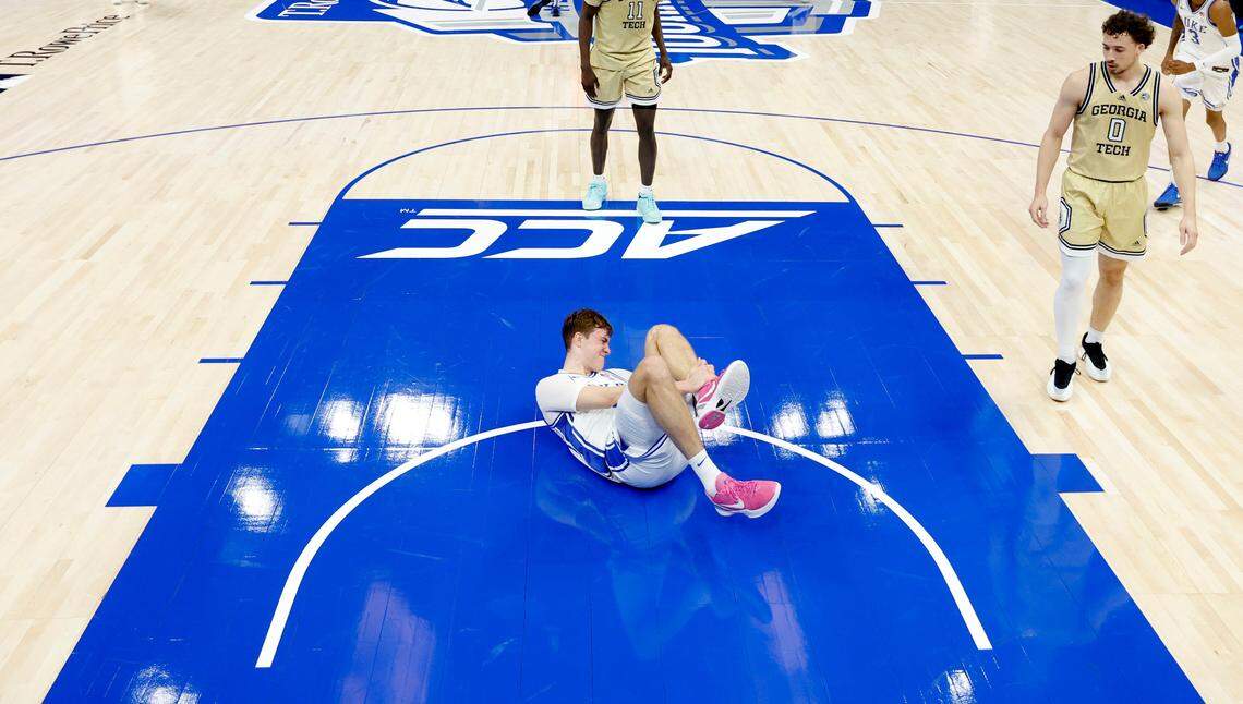 Duke’s Cooper Flagg (2) lies on the ground after injuring his ankle during Duke’s victory over Georgia Tech in the quarterfinals of the 2025 ACC Men’s Basketball Tournament at the Spectrum Center in Charlotte, N.C., Thursday, March 13, 2025.