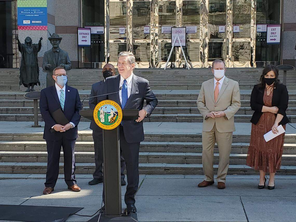 Gov. Roy Cooper speaks at a bipartisan news conference on school reopening.