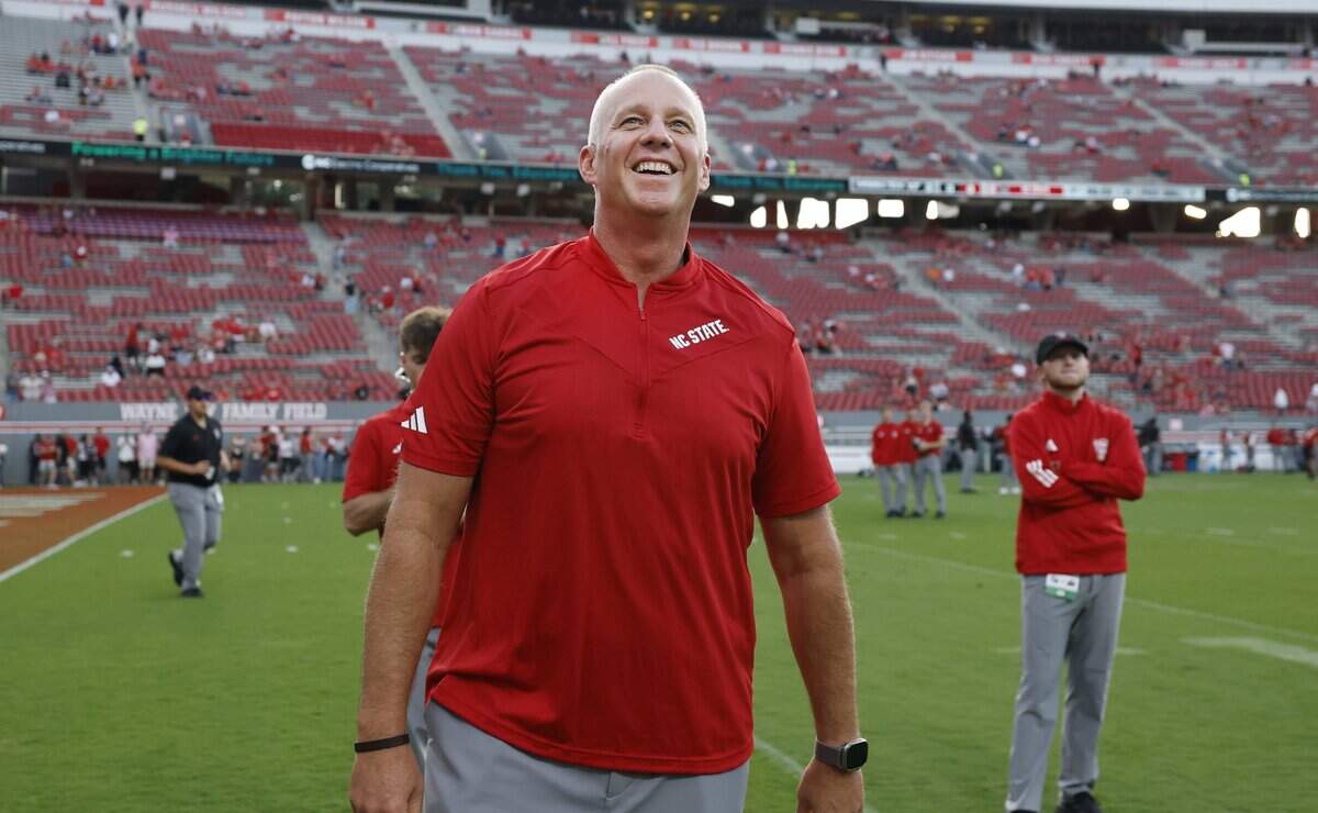 N.C. State head coach Dave Doeren smiles at the fans during the first half of N.C. State’s game against Virginia Tech at Carter-Finley Stadium in Raleigh, N.C., Saturday, Sept. 27, 2025.