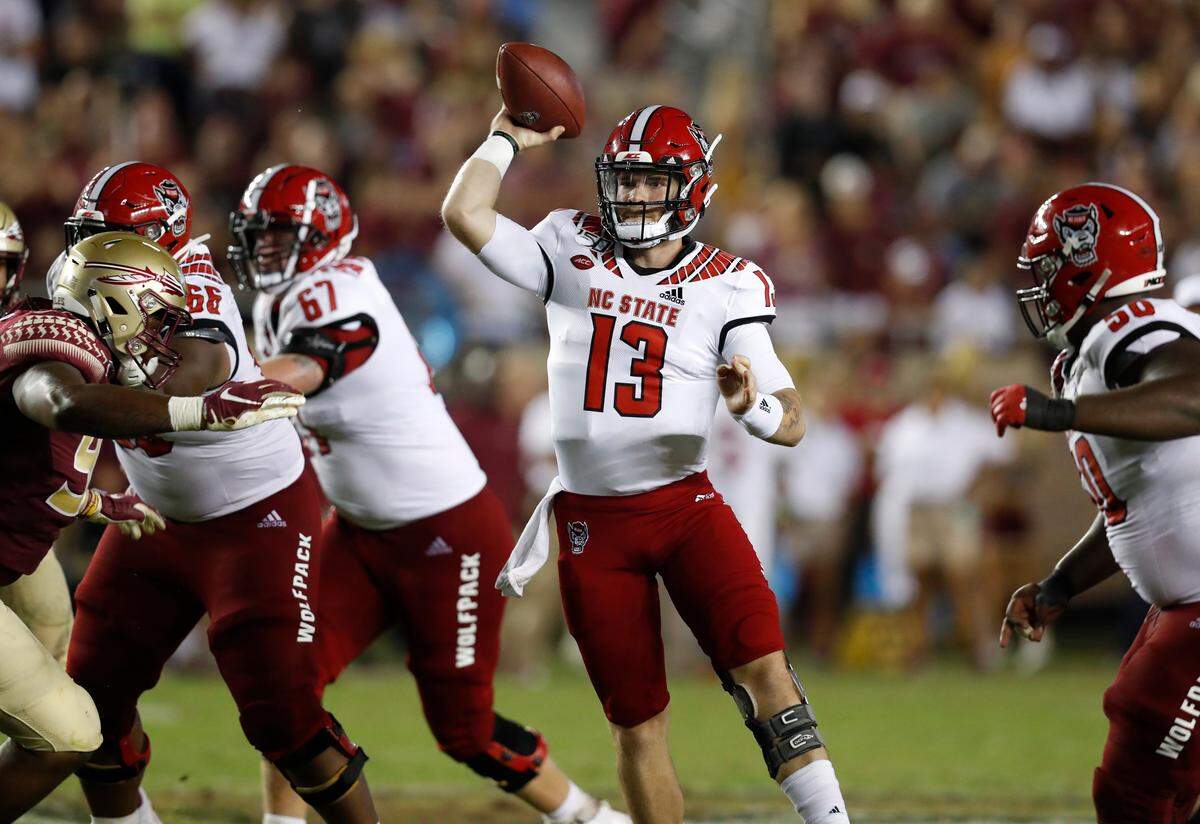 N.C. State quarterback Devin Leary (13) prepares to throw during the second half of Florida State’s 31-13 victory over N.C. State at Doak Campbell Stadium in Tallahassee, Fla., Saturday, Sept. 28, 2019.
