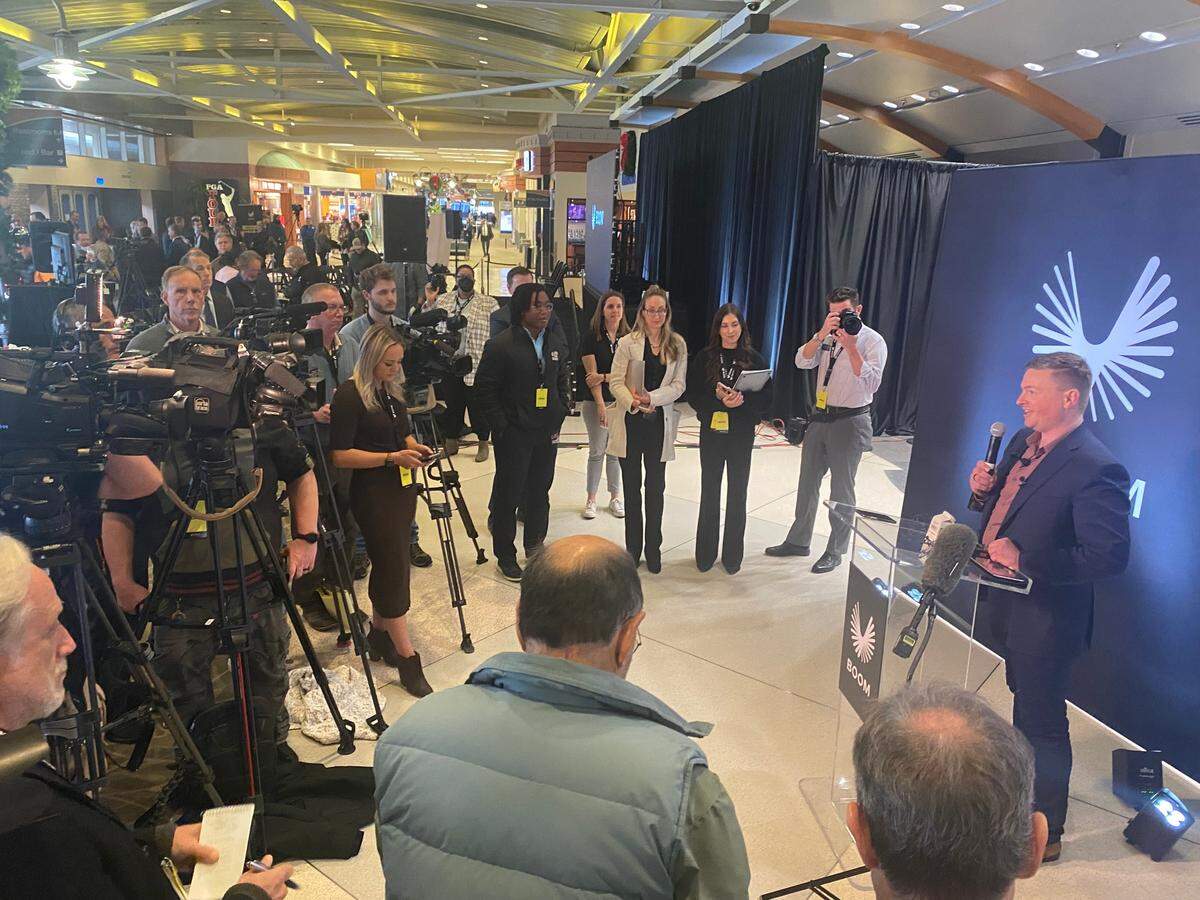 Boom Supersonic CEO Blake Scholl fields media questions after he unveiled his startup’s new Symphony engine design at the Piedmont Triad International Airport on Dec. 13.