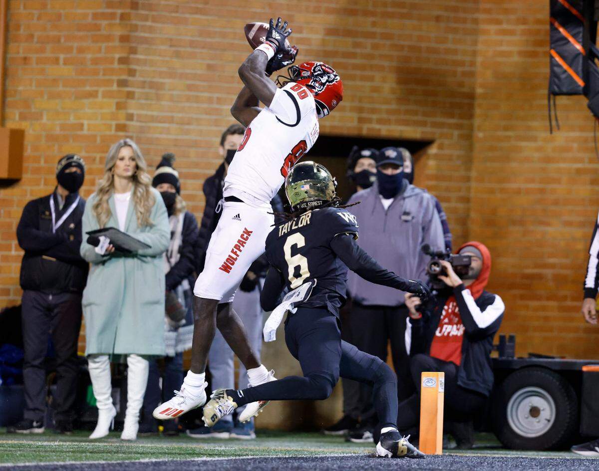 N.C. State wide receiver Emeka Emezie (86) pulls in a 28-yard touchdown reception during the first half of N.C. States game against Wake Forest at Truist Field in Winston-Salem, N.C., Saturday, November 13, 2021.