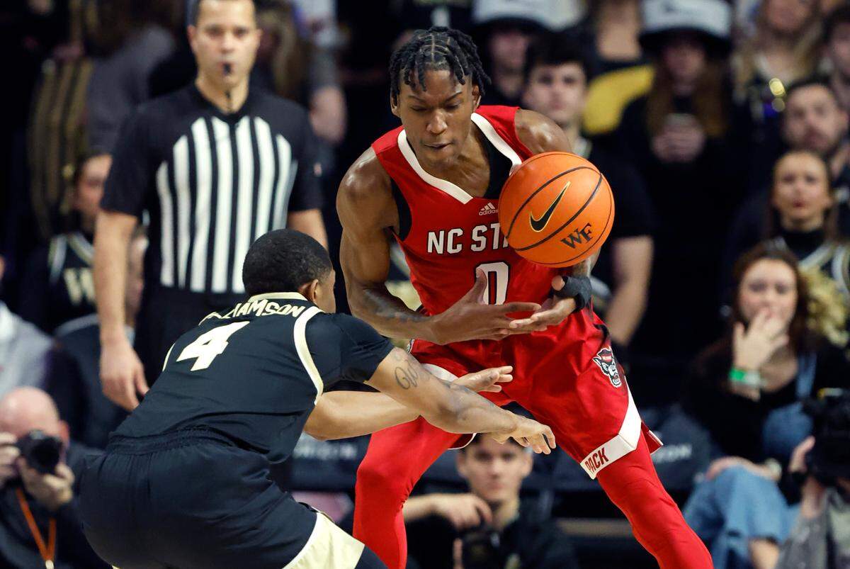 N.C. State’s Terquavion Smith (0) pulls the ball from Wake Forest’s Daivien Williamson (4) during the first half of N.C. State’s game against Wake Forest at Joel Coliseum in Winston-Salem, N.C., Saturday, Jan. 28, 2023.