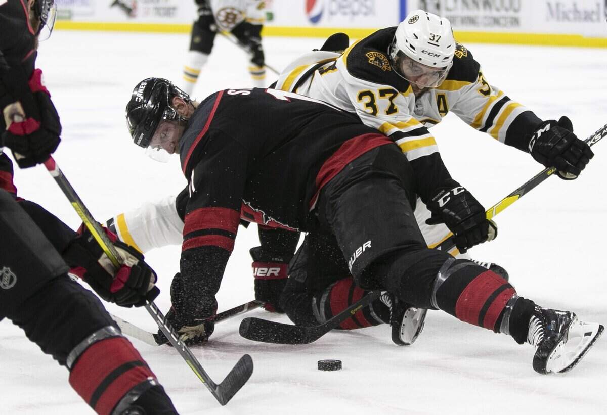 Carolina Hurricanes Jordan Staal (11) battles with Boston Bruins’ Patrice Bergeron (37) during a face-off in the second period in Game 4 of the Eastern Conference finals on Thursday, May 16, 2019 at PNC Arena in Raleigh, N.C.