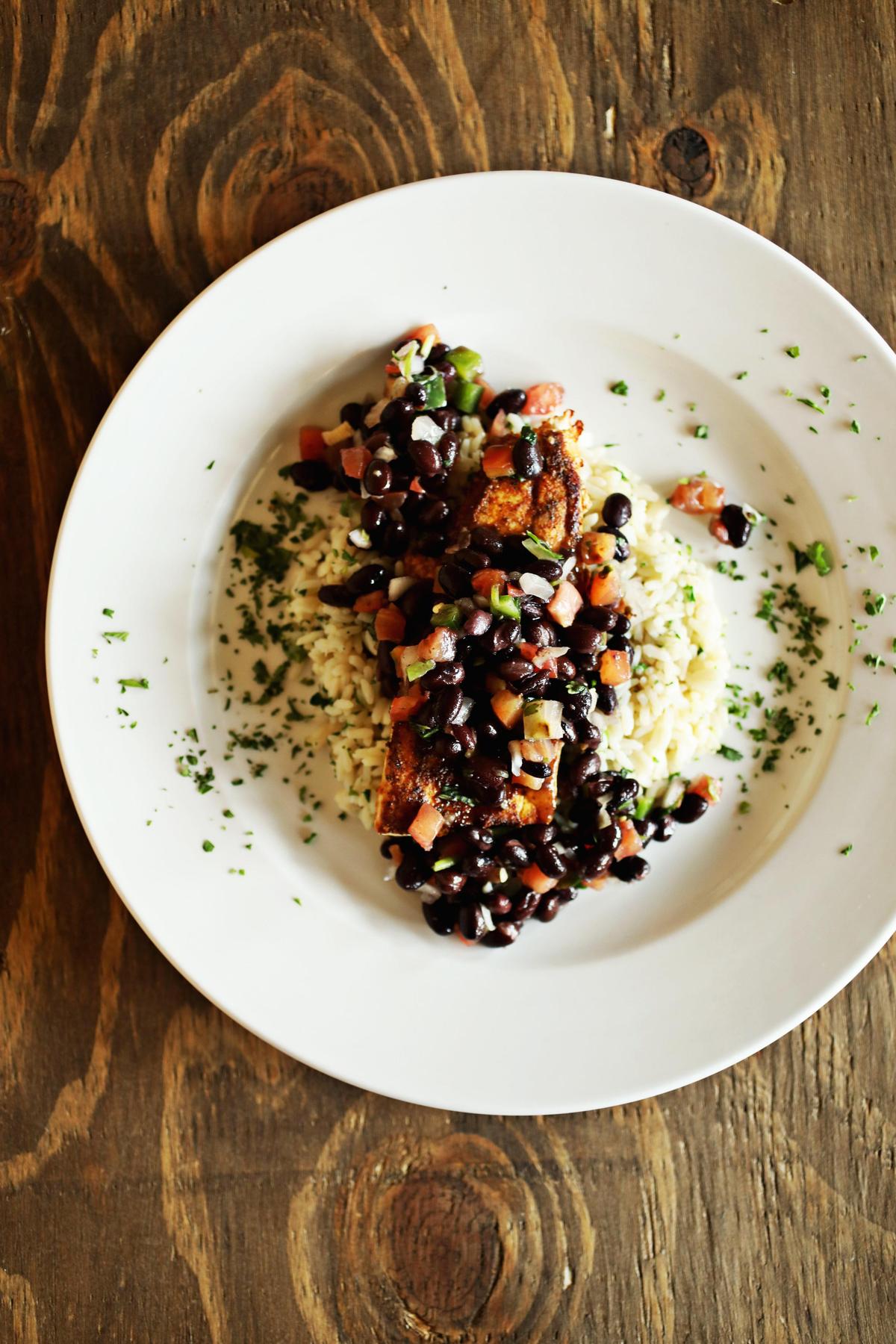 The Southwest seasoned mahi mahi is served over rice with black bean salsa on the specials menu at The Blind Pelican in Holly Springs.