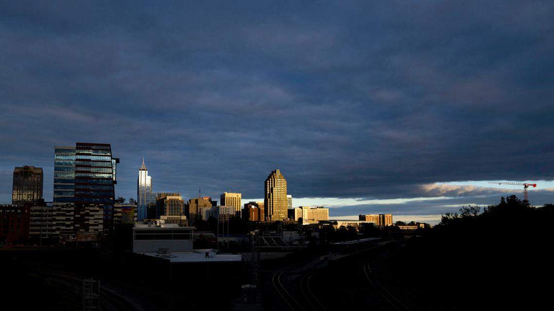 The late evening sun illuminates parts of downtown Raleigh as clouds cover the sky Monday evening, Oct. 16, 2023.