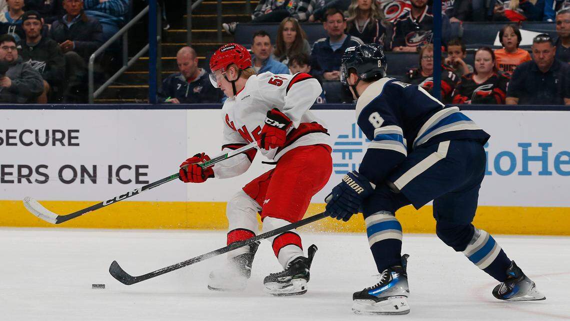 Carolina Hurricanes right wing Jackson Blake (53) carries the puck as Columbus Blue Jackets defenseman Zach Werenski (8) defends during the first period at Nationwide Arena.