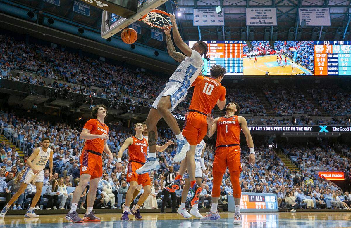 North Carolina’s Armando Bacot (5) gets a dunks over Clemson’s Ben Middlebrooks (10) in the first half on Saturday, February 11, 2023 at the Smith Center in Chapel Hill, N.C.