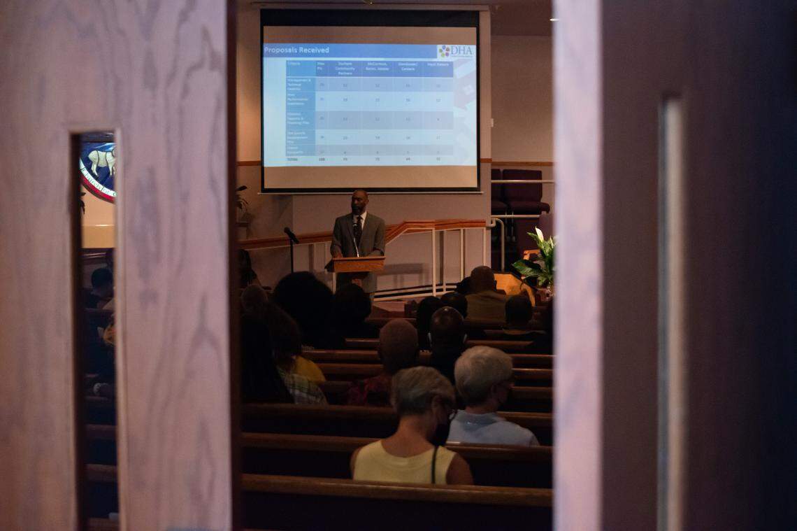 Durham Housing Authroity CEO, Anthony Scott (foreground), shares his remarks with Durham residents at a Durham City Council special meeting held at the Monument of Faith Church to address the proposed plans for Fayette Place, on Monday, June 13, 2022.