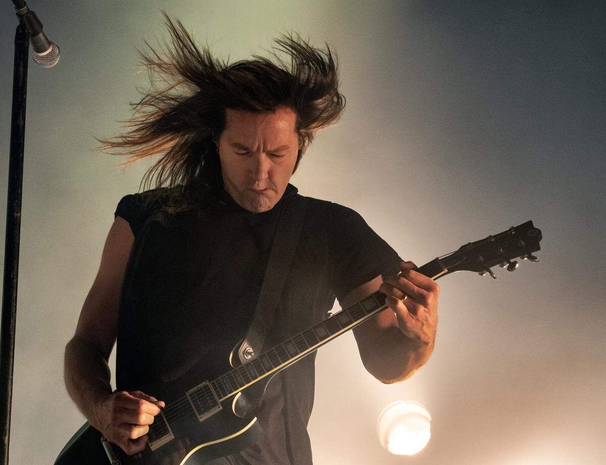 Robin Finck on guitar for Nine Inch Nails as the band opens its 2022 U.S. tour at Raleigh, N.C.’s Red Hat Amphitheater, Thursday night, April 28, 2022.