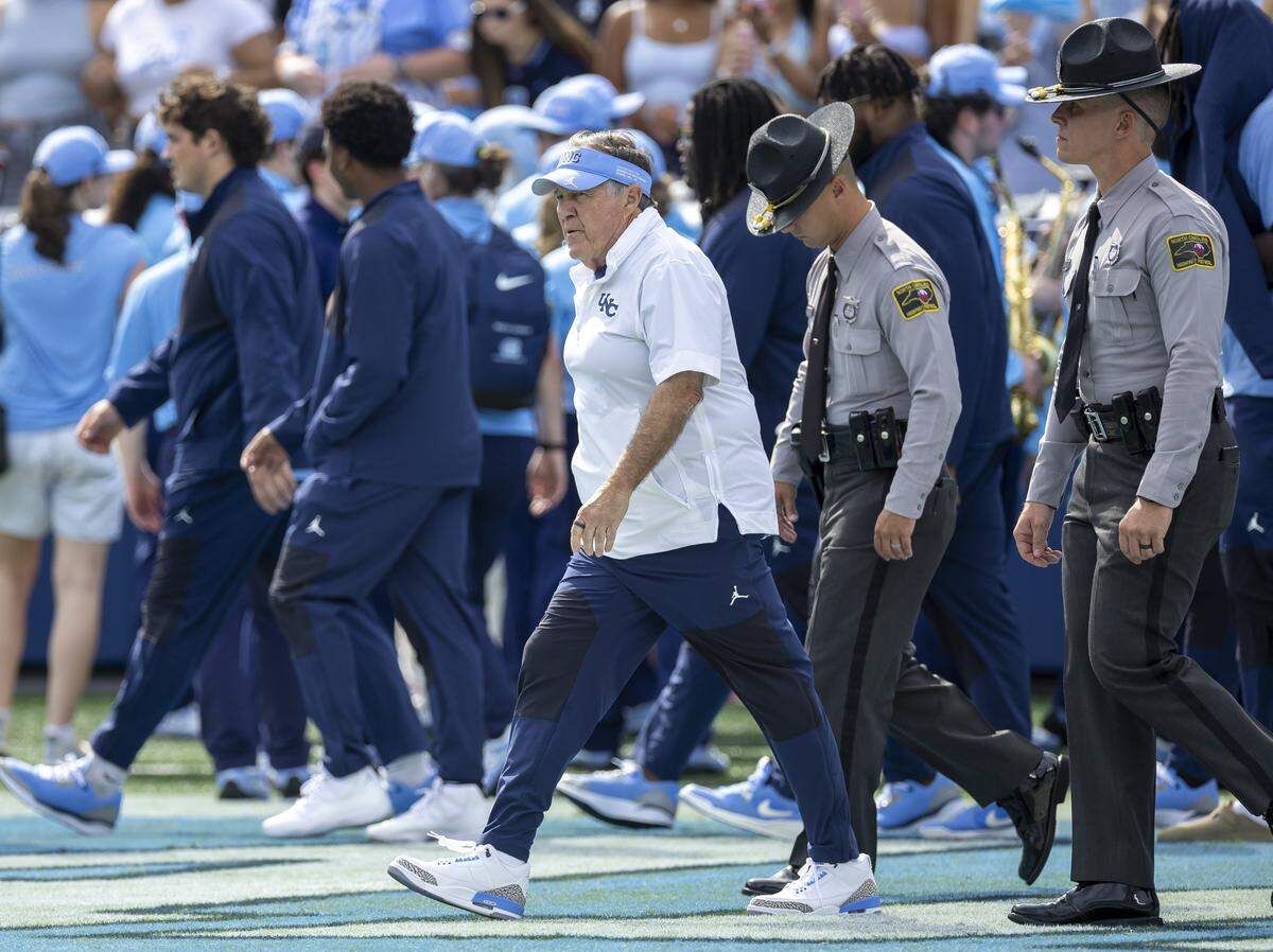 North Carolina coach Bill Belichick enters the playing field after his players prior to the Tar Heels’ game against Richmond on Saturday, September 13, 2025 at Kenan Stadium in Chapel Hill, N.C.